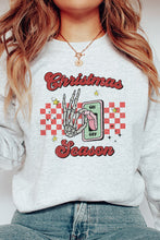 Load image into Gallery viewer, a woman wearing a christmas sweatshirt and jeans